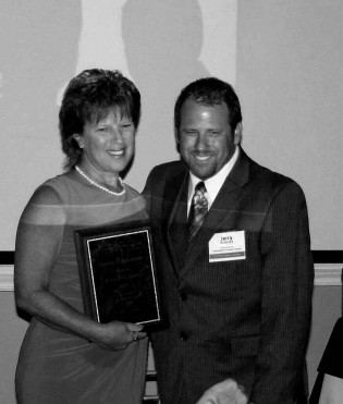 Kimberly Lewis, receiving Lifetime WVAMA Honorary Membership award from Jerry Brienza, president of the WVAMA